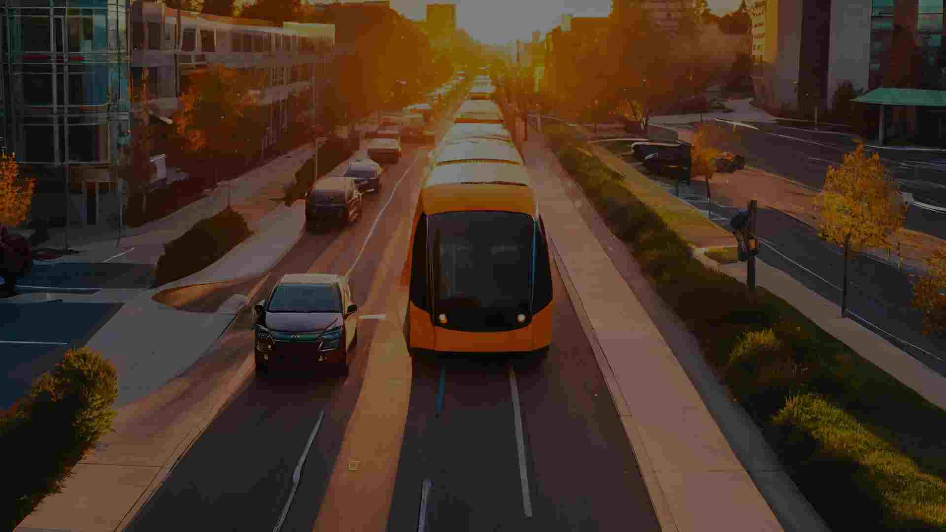 autonomous driving concept in a city at sunset